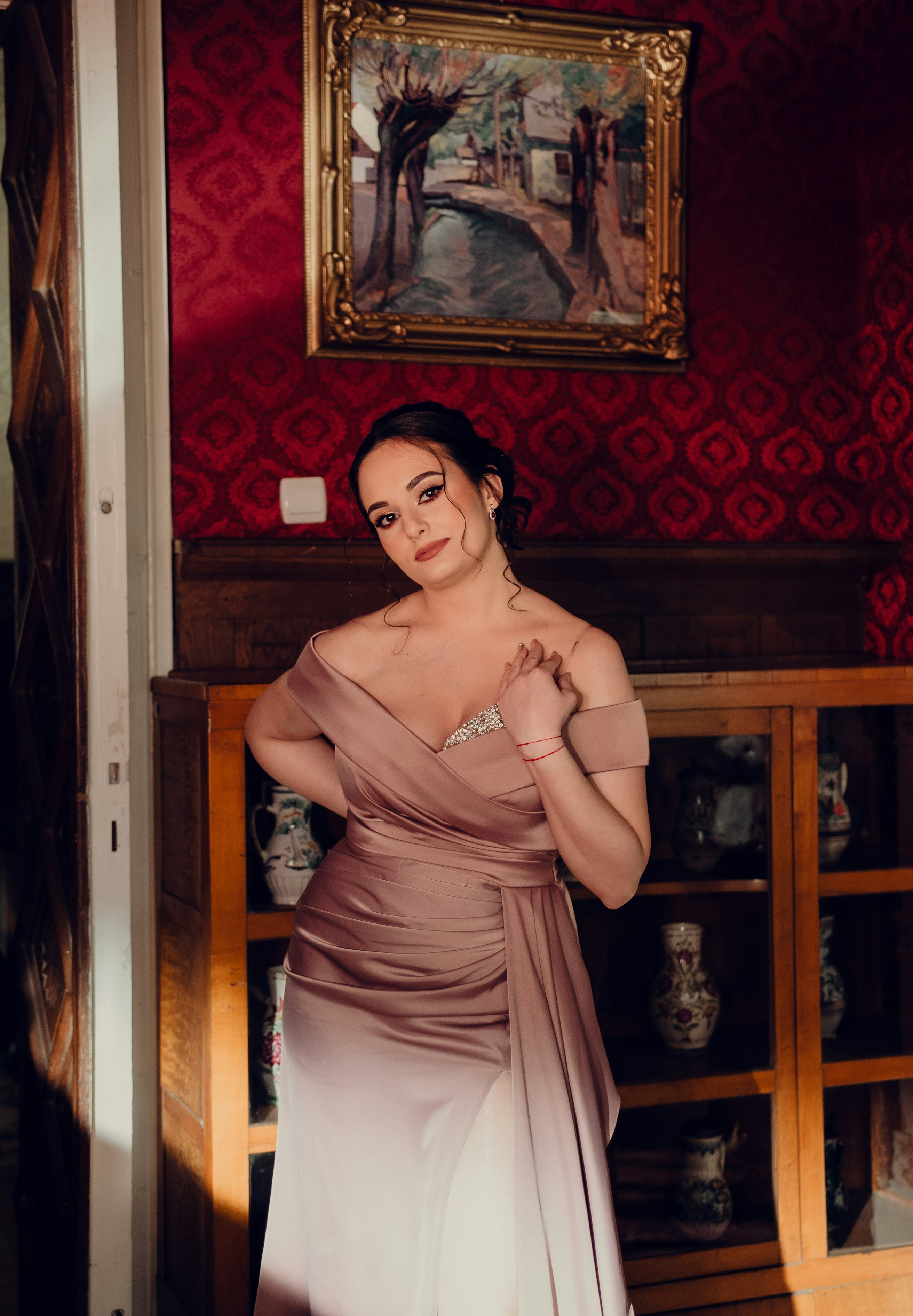 A woman in a dress standing in a room