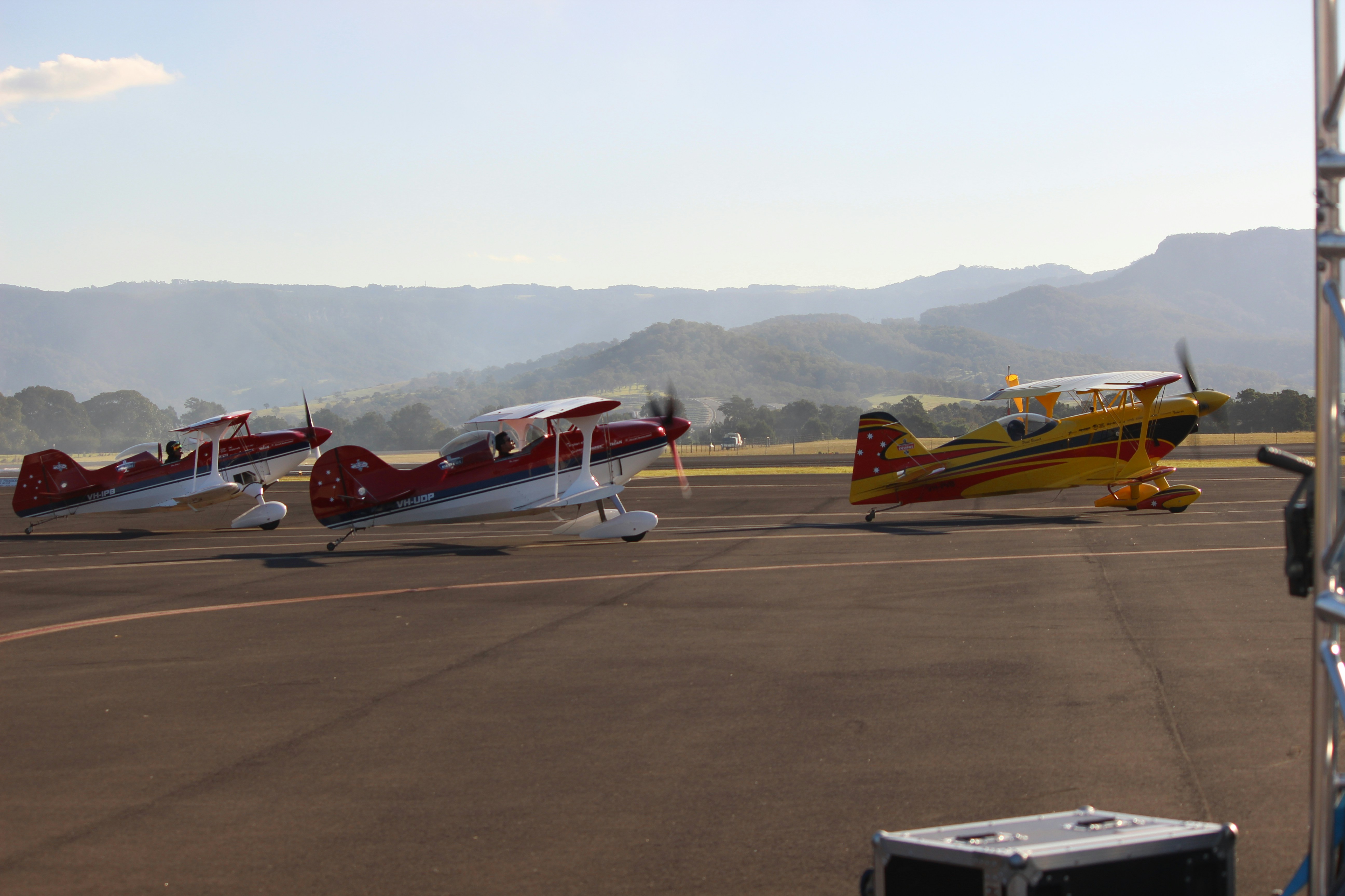 A group of small airplanes sitting on top of an airport tarmac photo ...