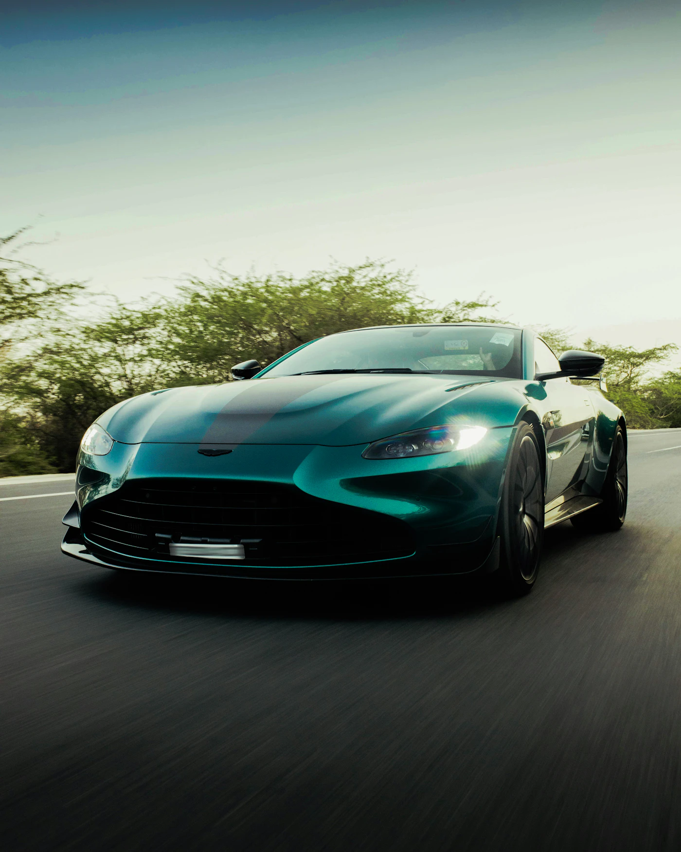 Luxury sports car driving on an open road
