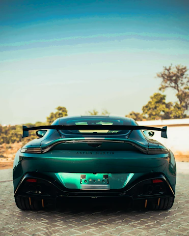 A green sports car parked in a parking lot