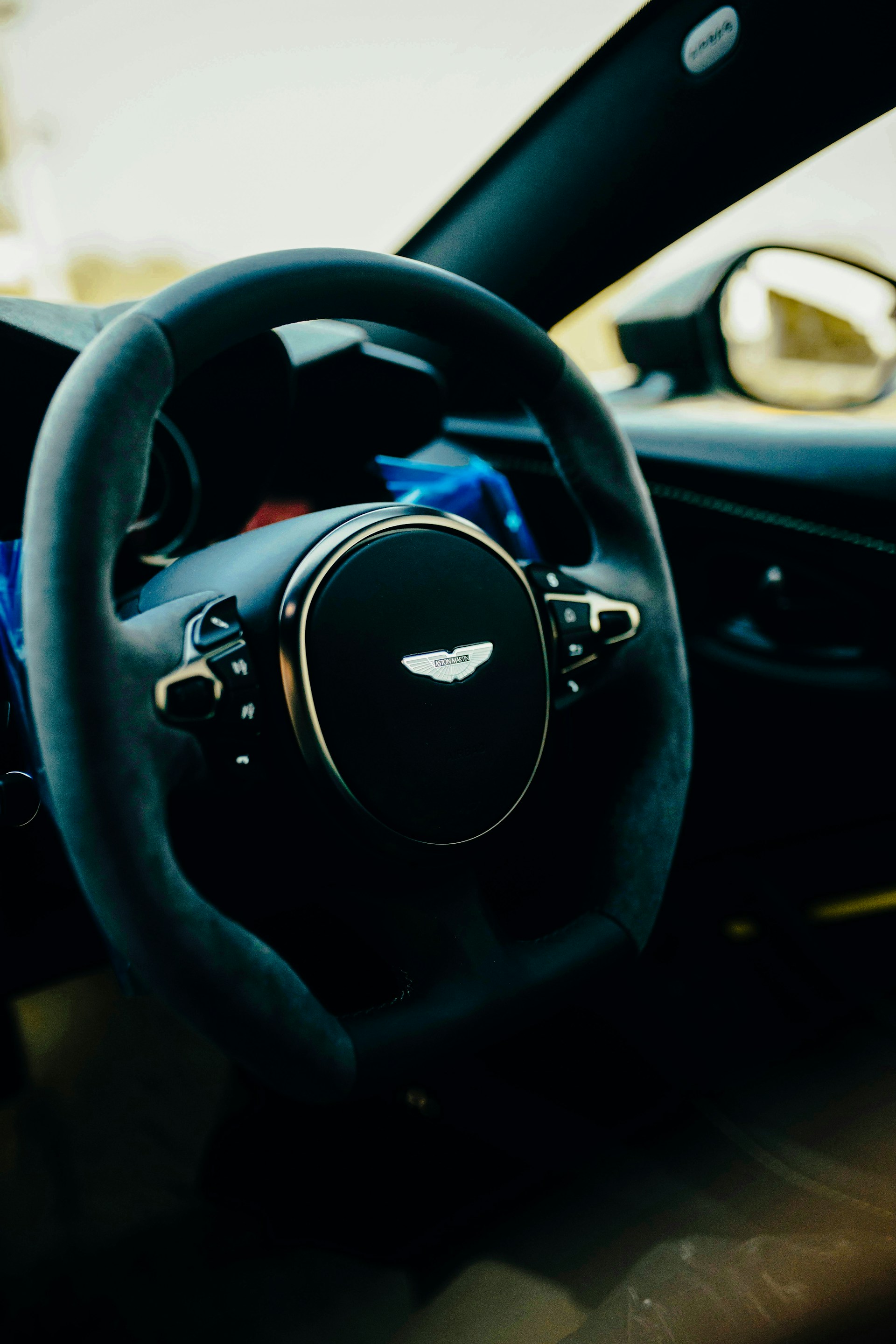 The interior of a car with a steering wheel