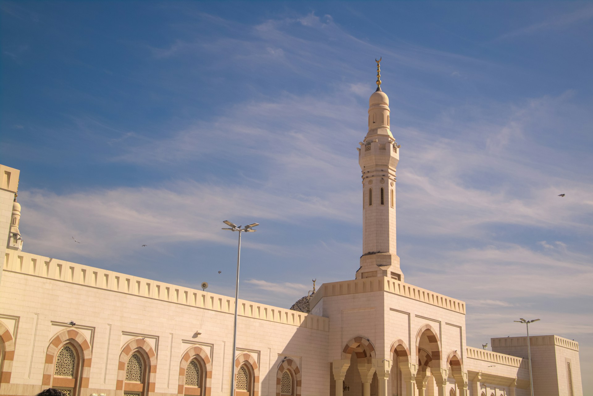 A large white building with a clock tower