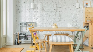 A dining room with a table and chairs