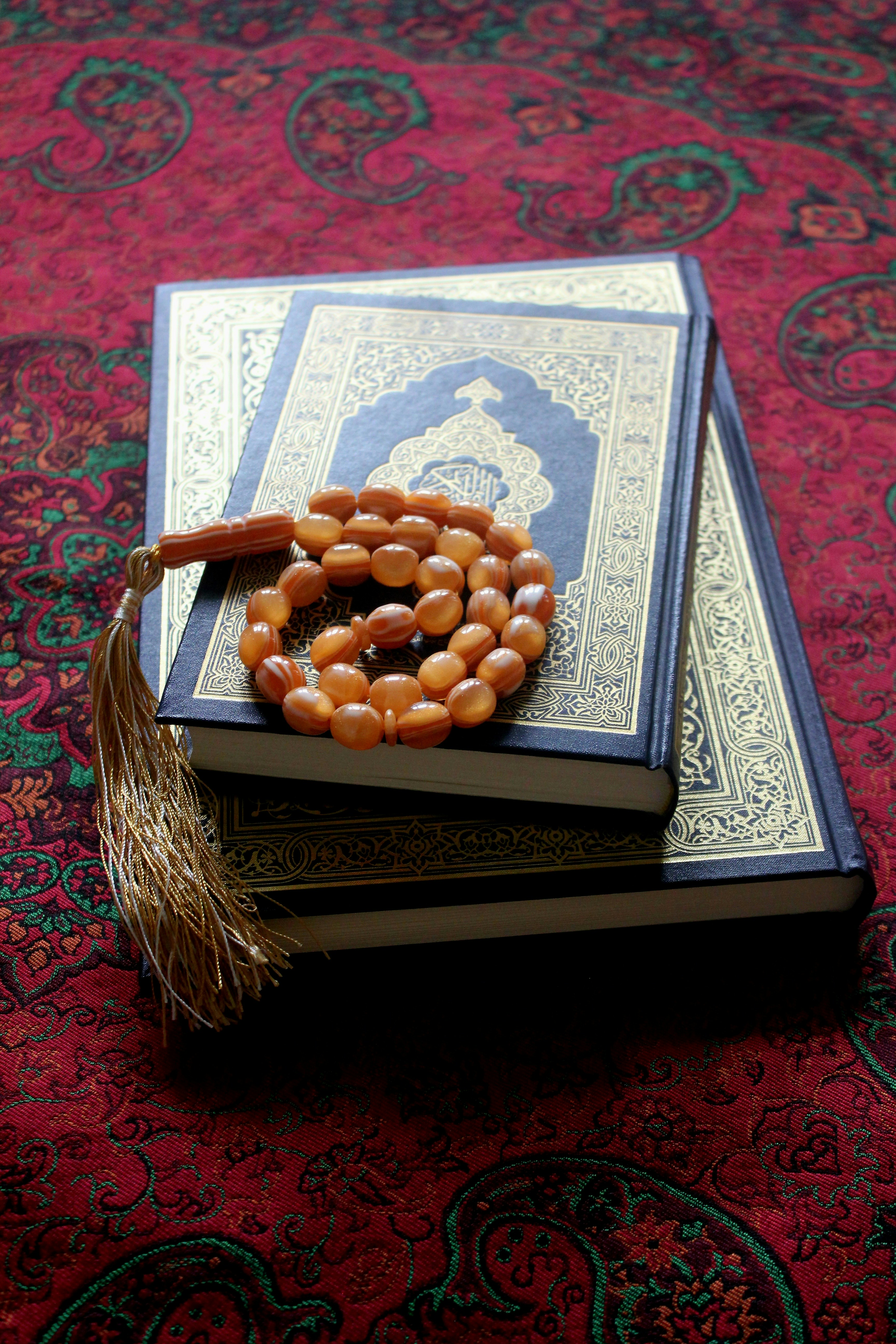 Open Quran with prayer beads