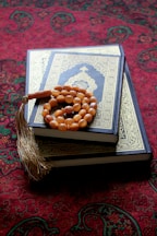 A pile of books sitting on top of a carpet