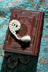 A book with a tassel on top of it