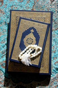 A book with a tassel on top of it