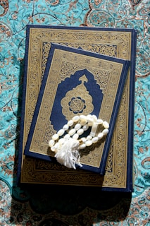A book with a tassel on top of it