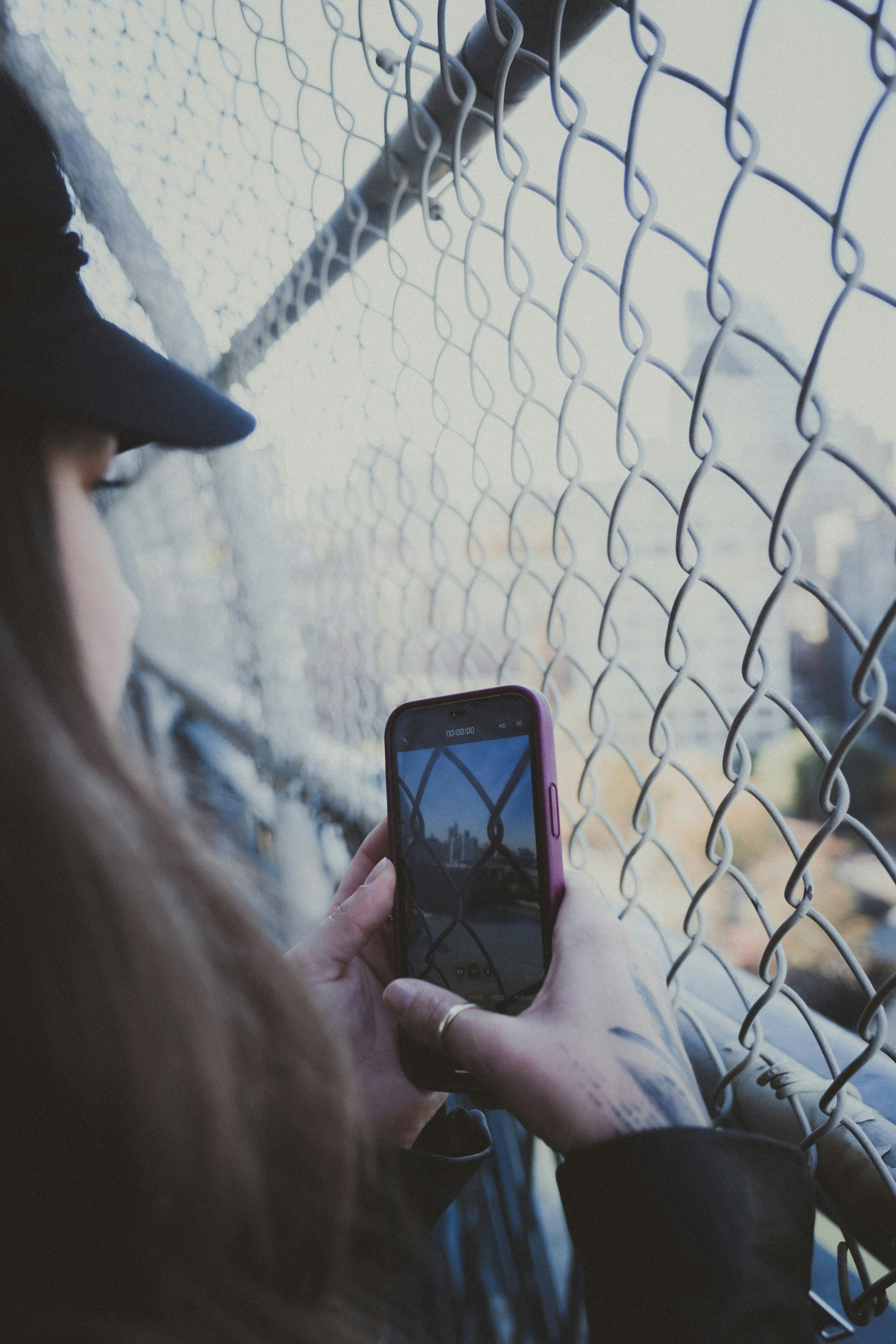 A woman is looking at her cell phone