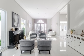 A living room filled with furniture and white walls