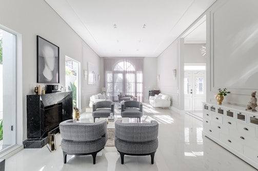 A living room filled with furniture and white walls