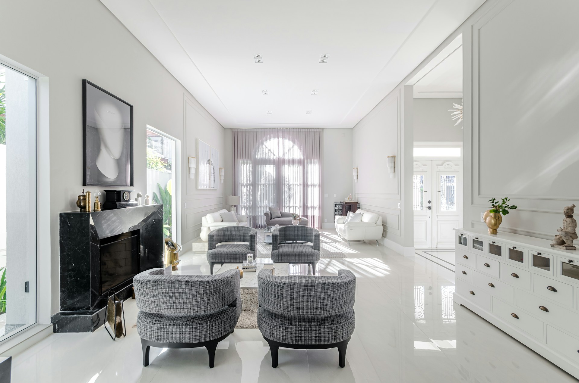 A living room filled with furniture and white walls