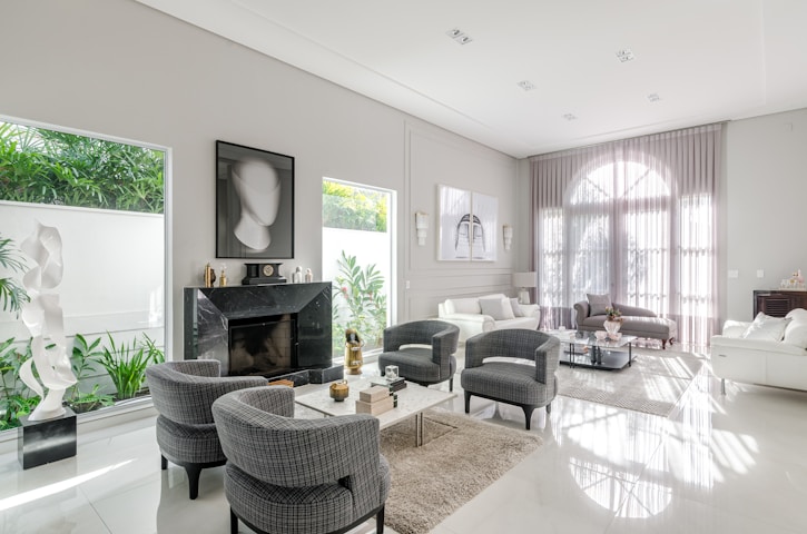 A living room filled with furniture and a fire place