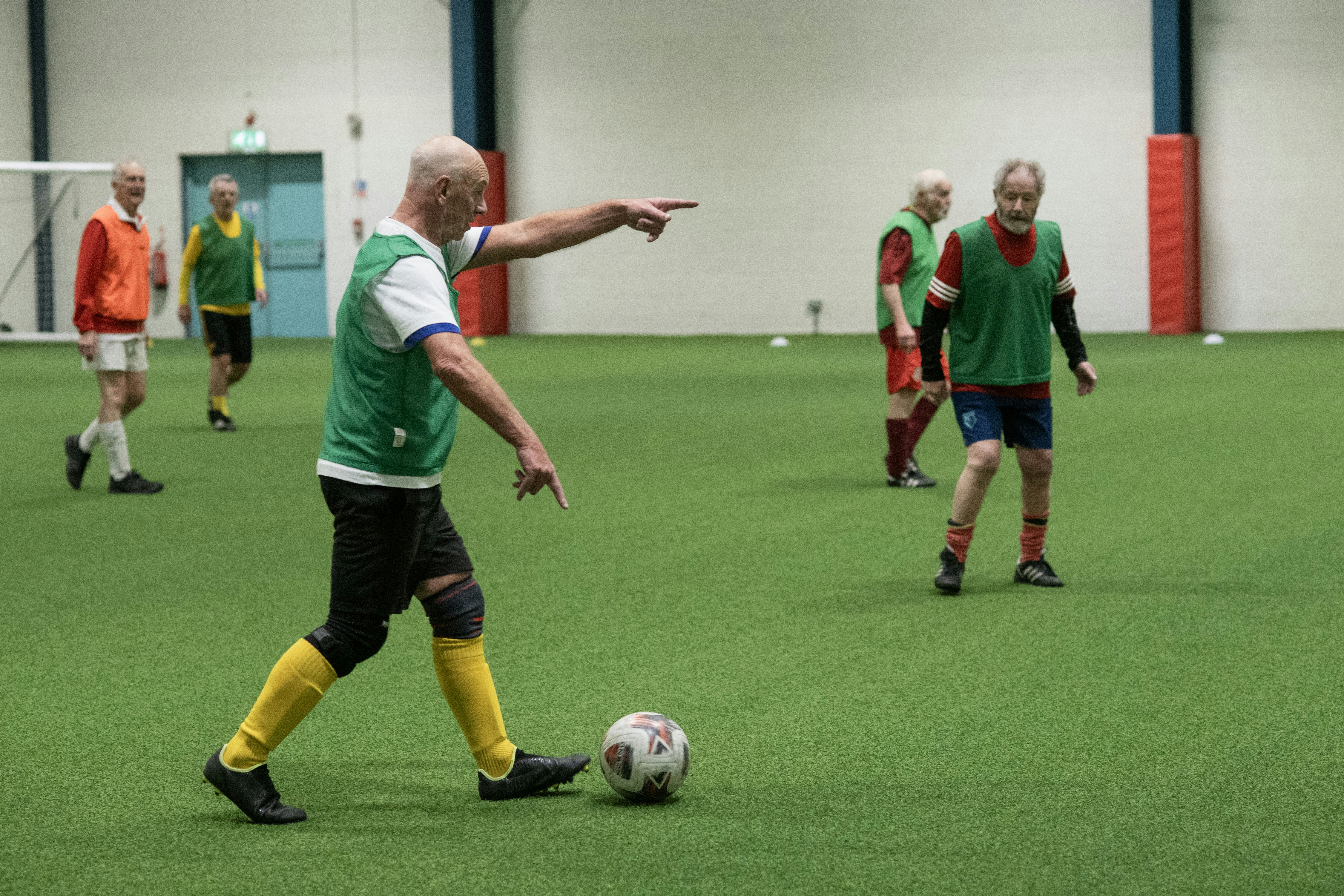 A group of men playing a game of soccer