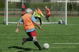 A group of people playing a game of soccer