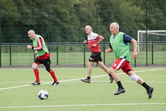 A group of men playing a game of soccer