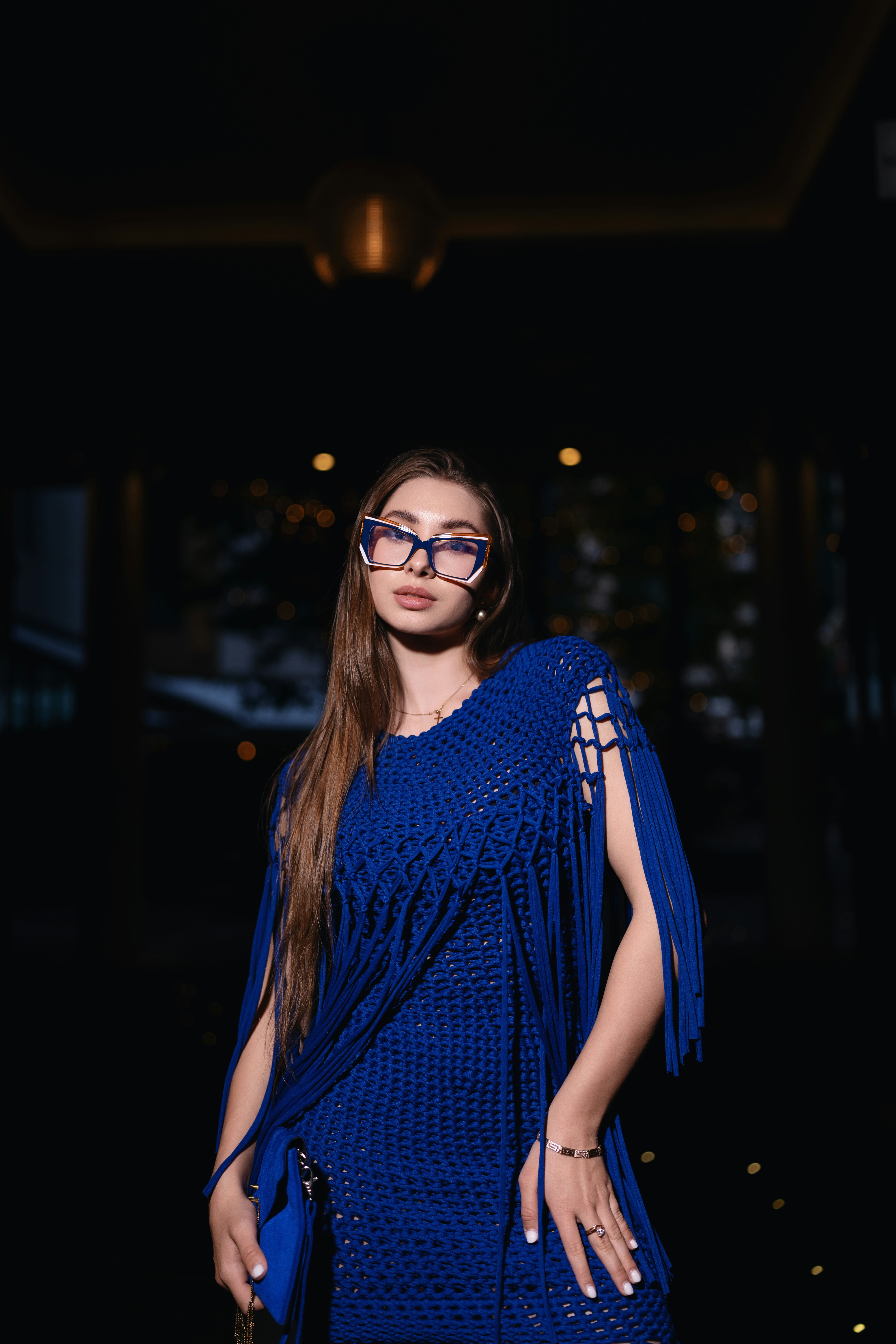 A woman in a blue dress posing for a picture