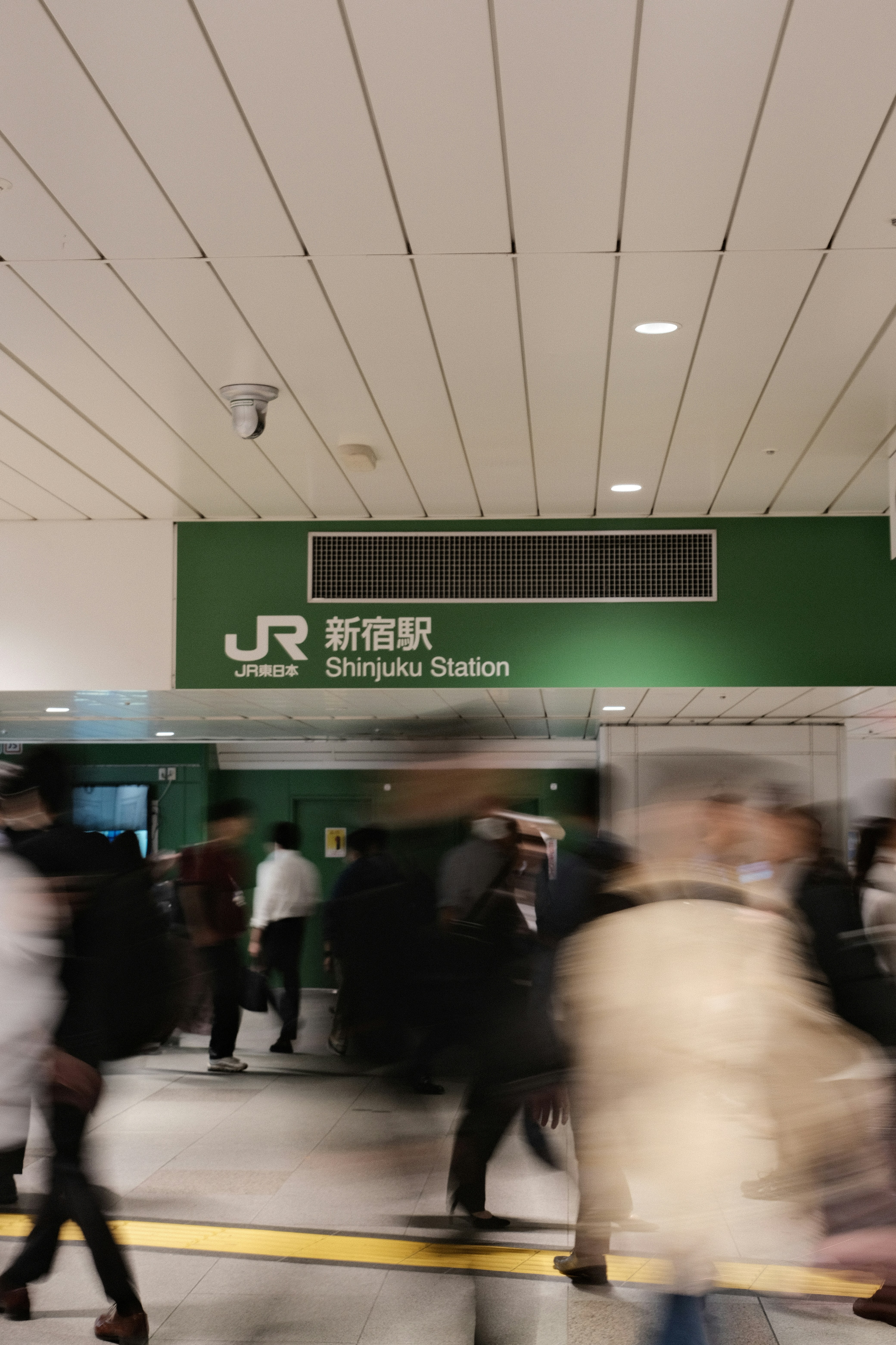 A blurry photo of a group of people at an airport