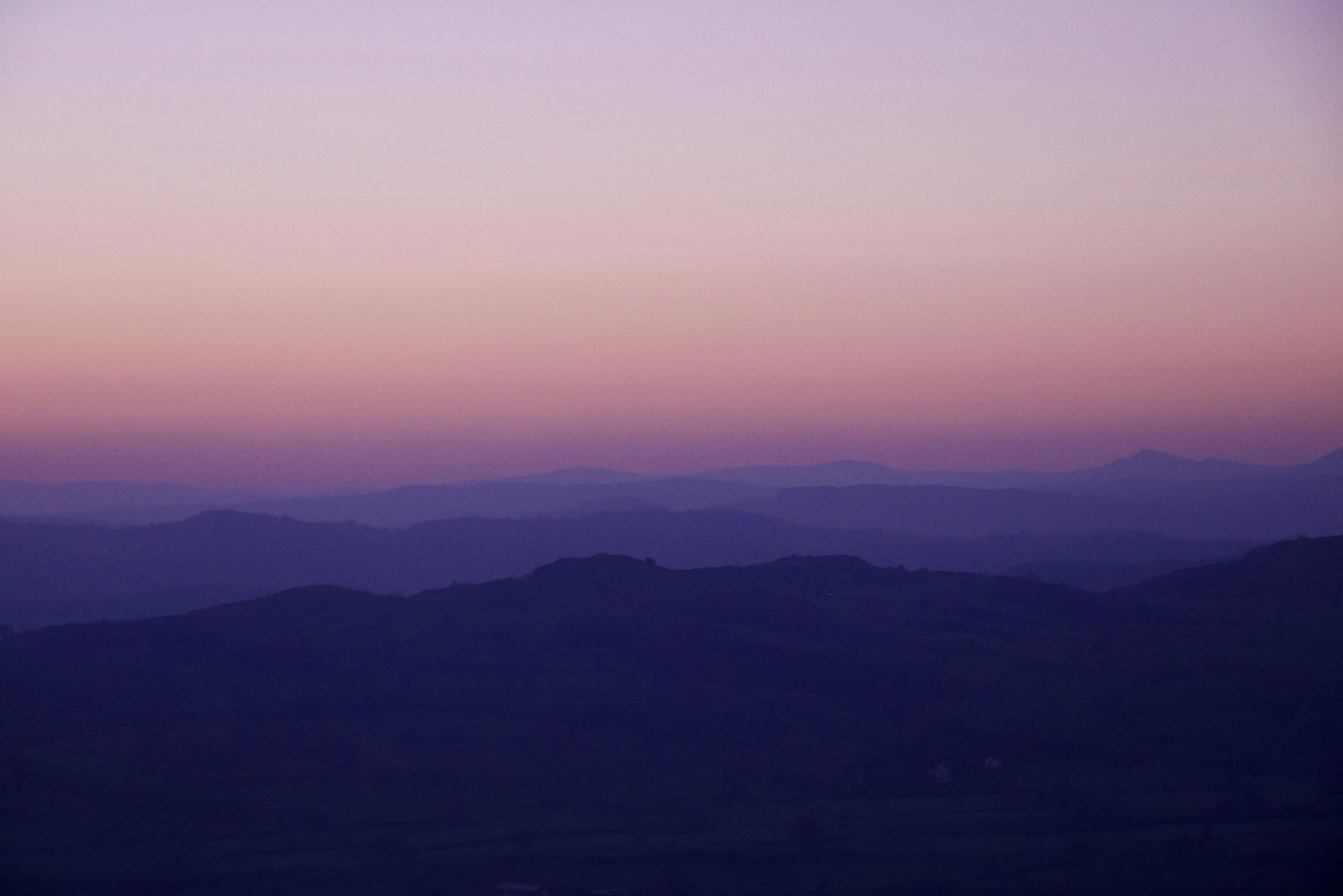 A view of a mountain range at sunset