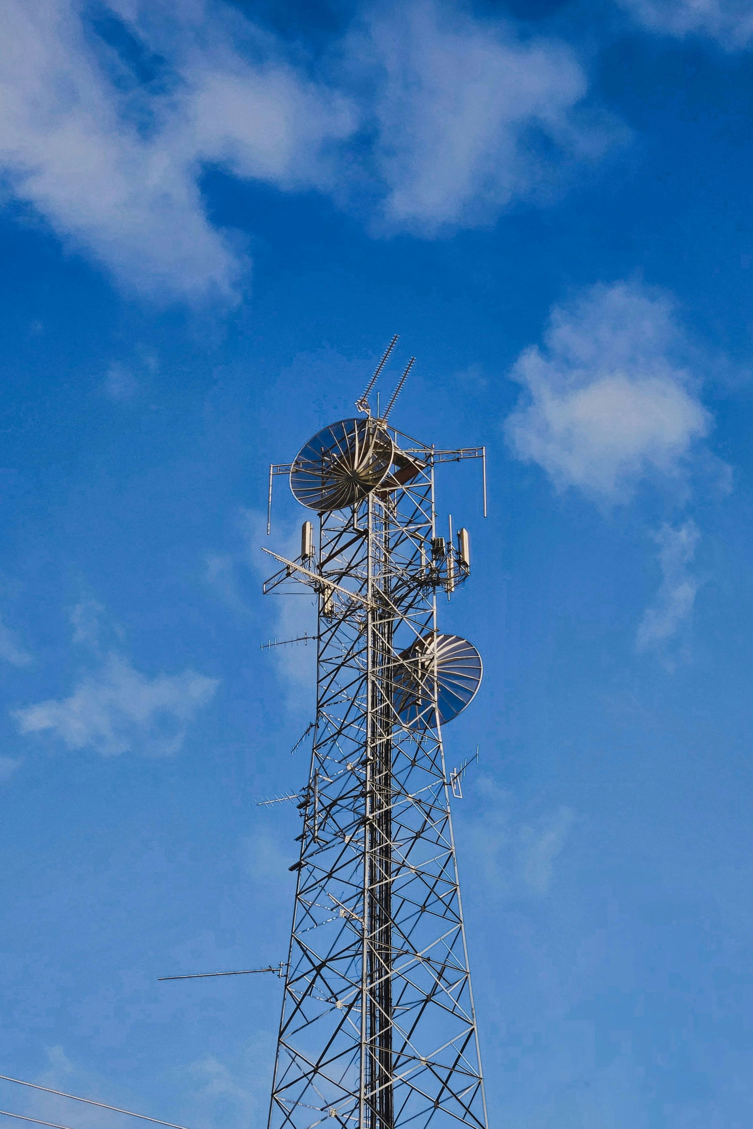 A very tall tower with a bunch of antennas on top of it