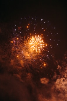 A large fireworks is lit up in the night sky