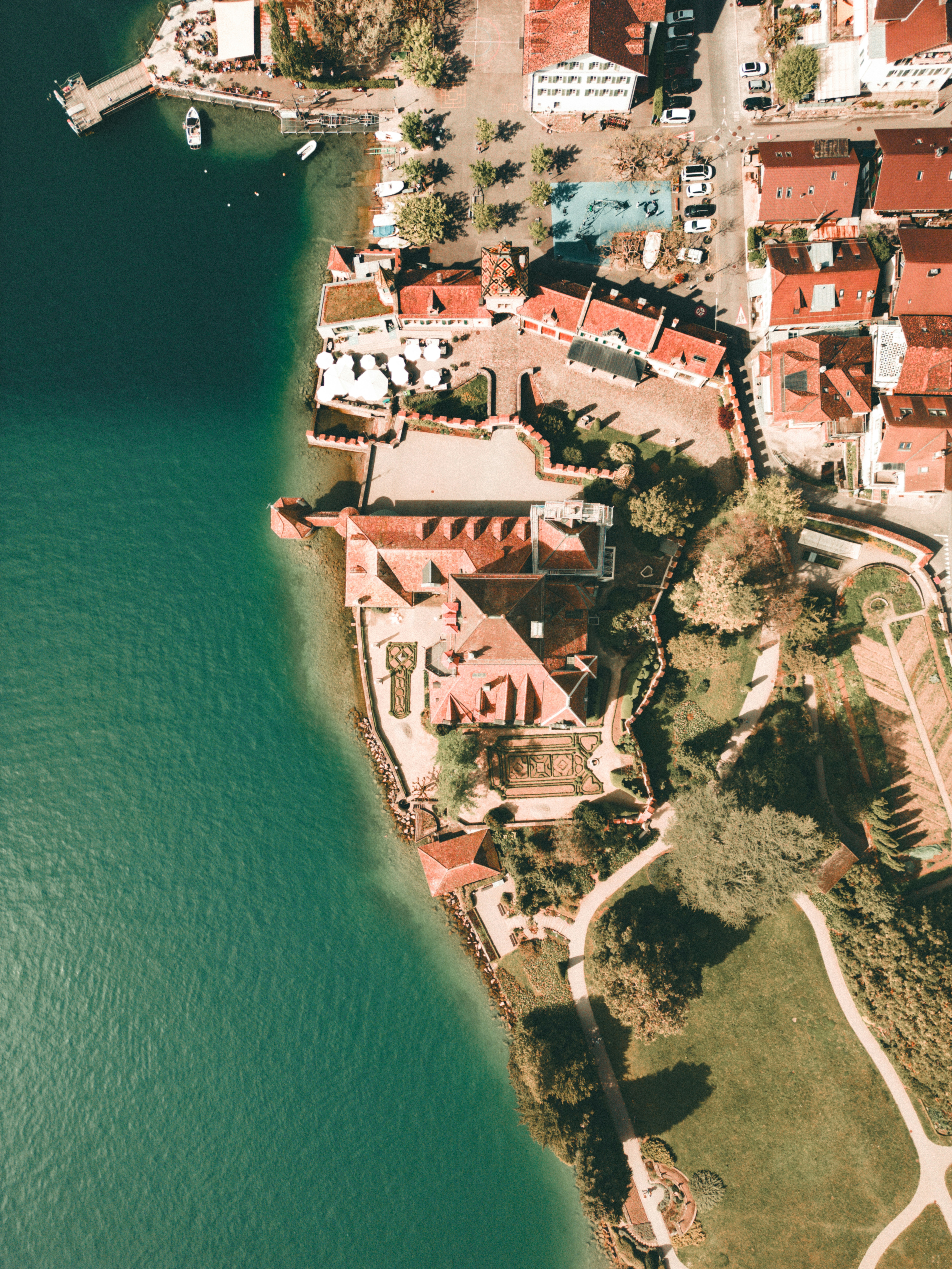 An aerial view of a city next to a body of water