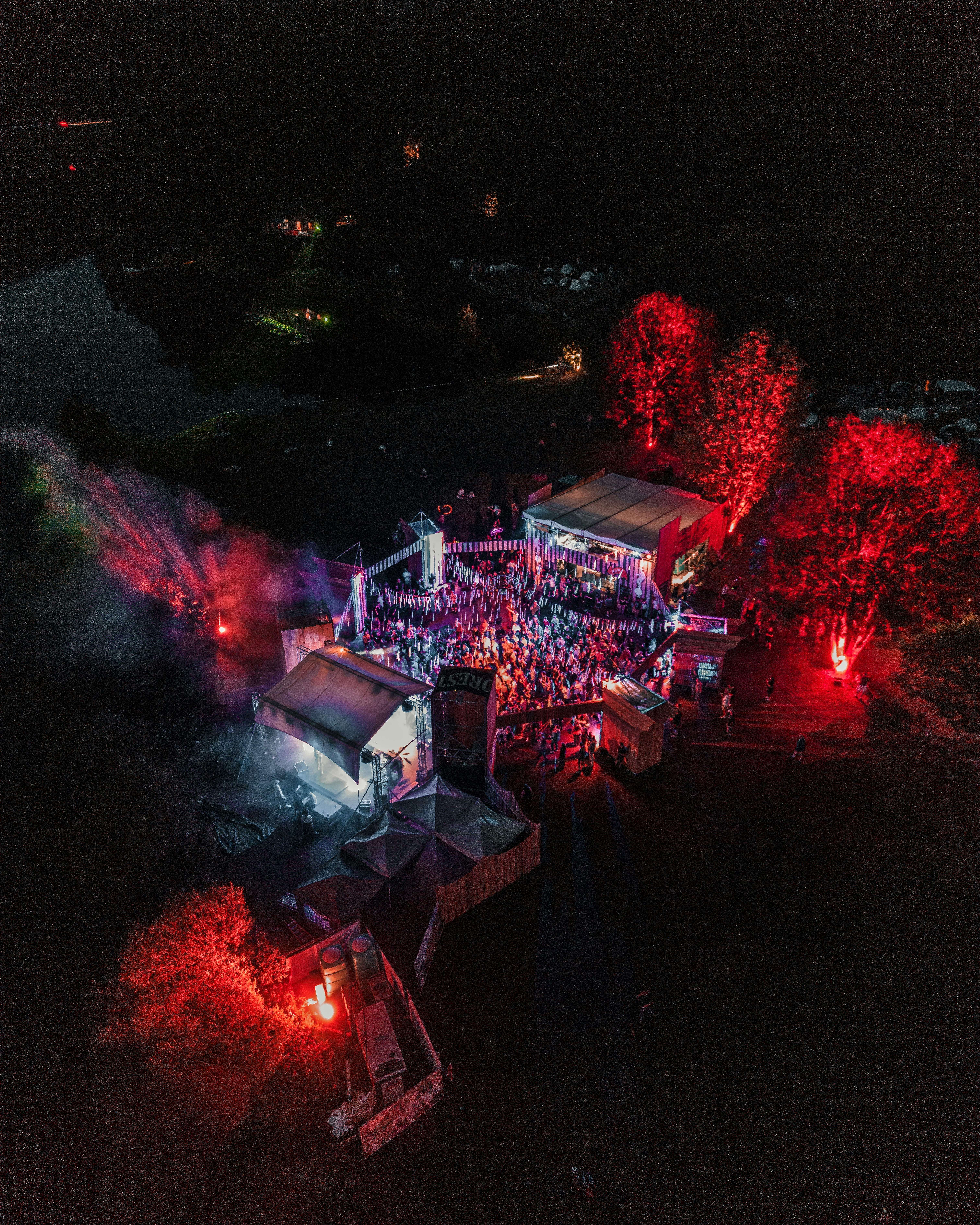 An aerial view of a house lit up at night