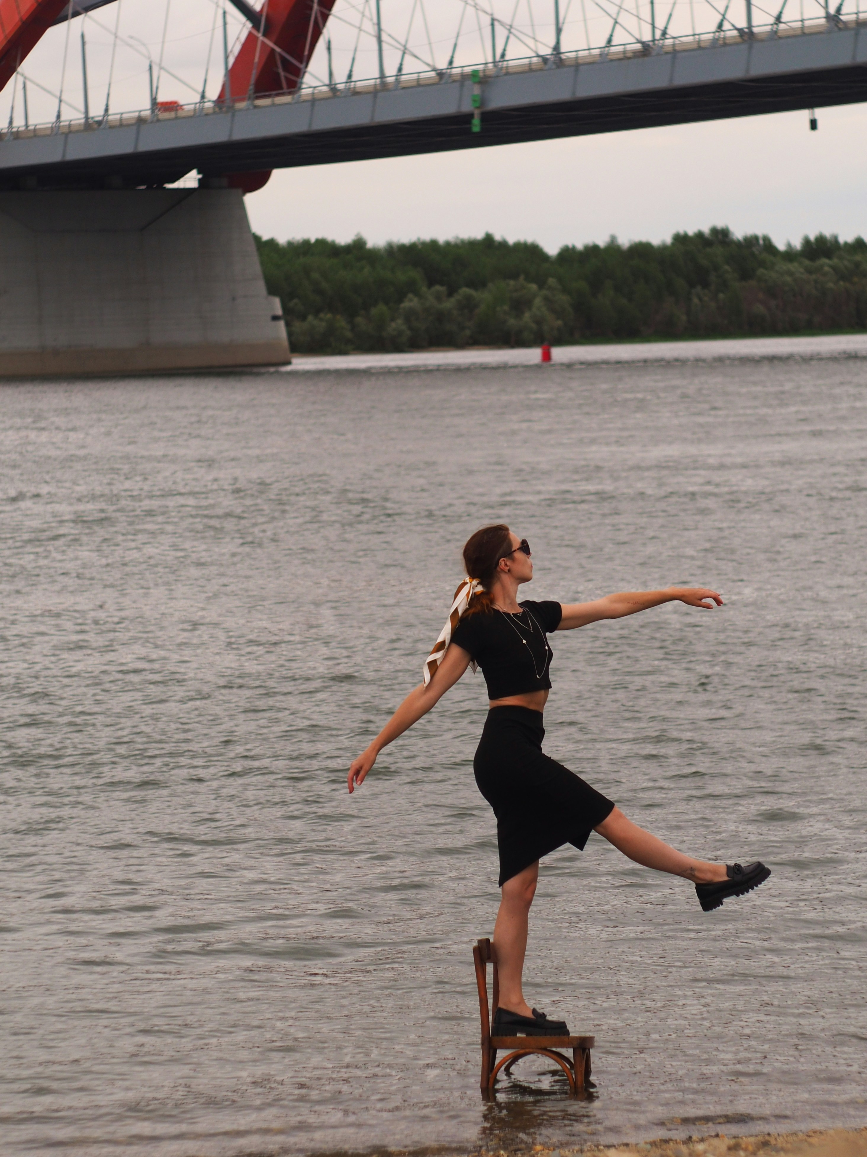A woman standing on a chair in the water photo – Free Novosibirsk Image ...