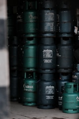 A bunch of gas cans stacked on top of each other