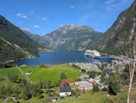 A scenic view of a small town and a large body of water