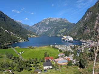 A scenic view of a small town and a large body of water