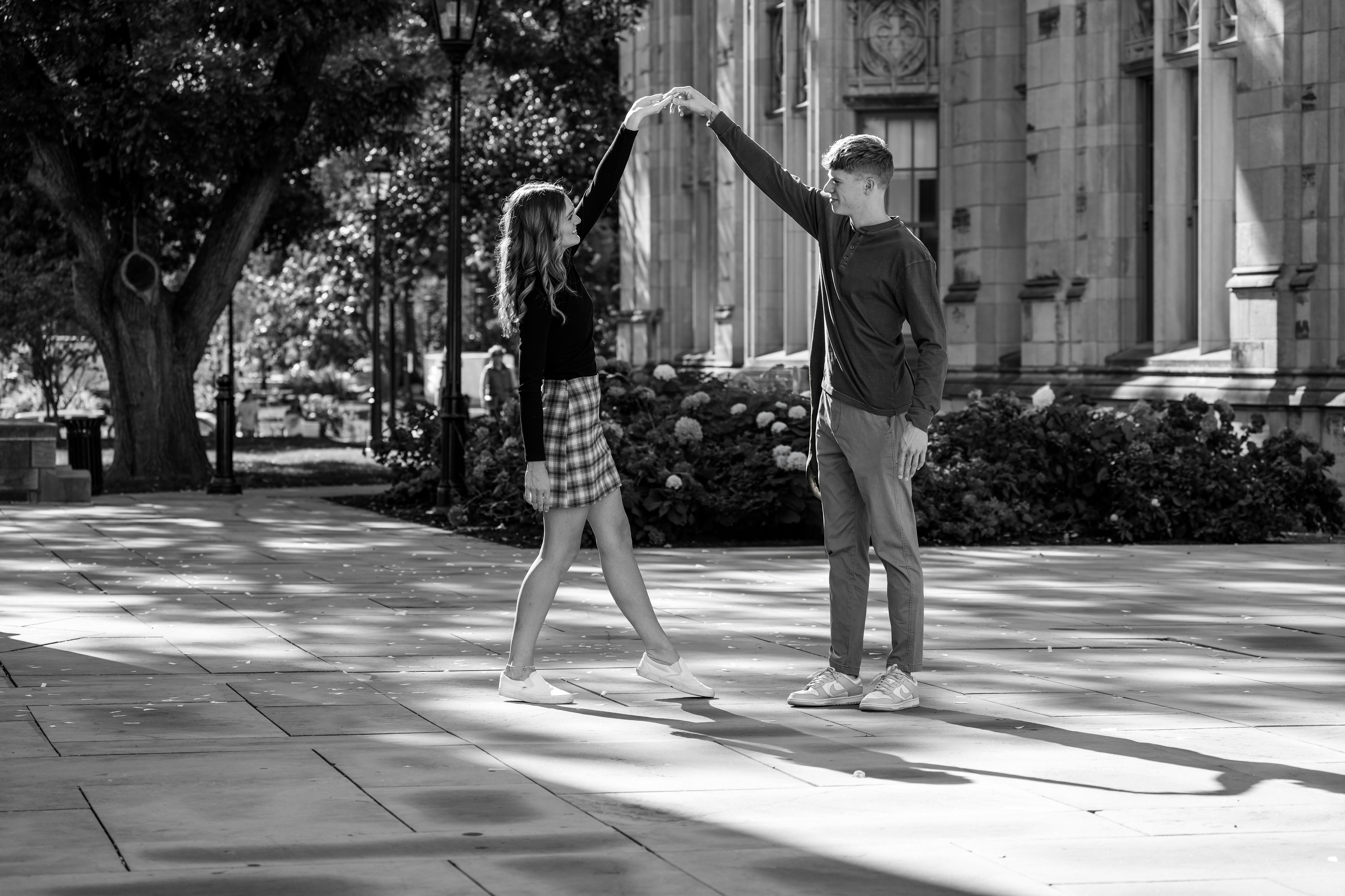 A couple of people that are standing in the street