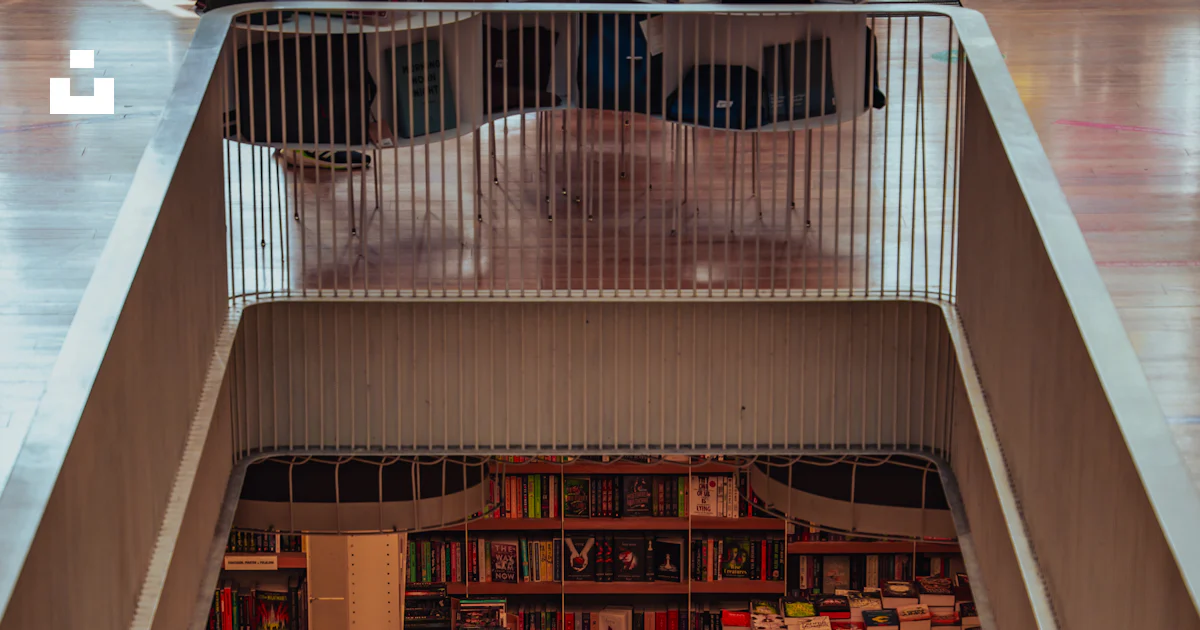An overhead view of a library with a staircase photo – Free Wallpaper ...