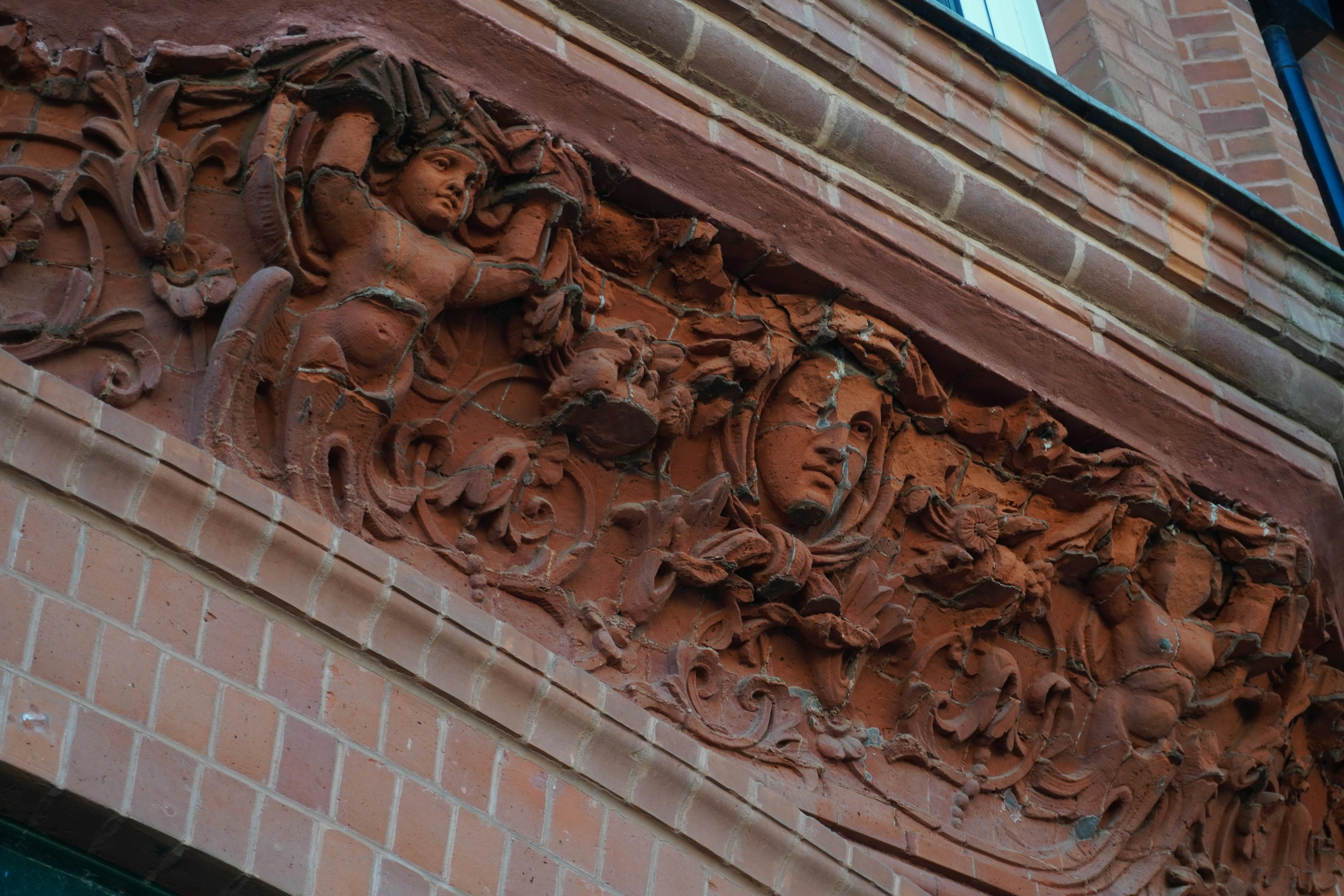 A close up of a building with a clock on it