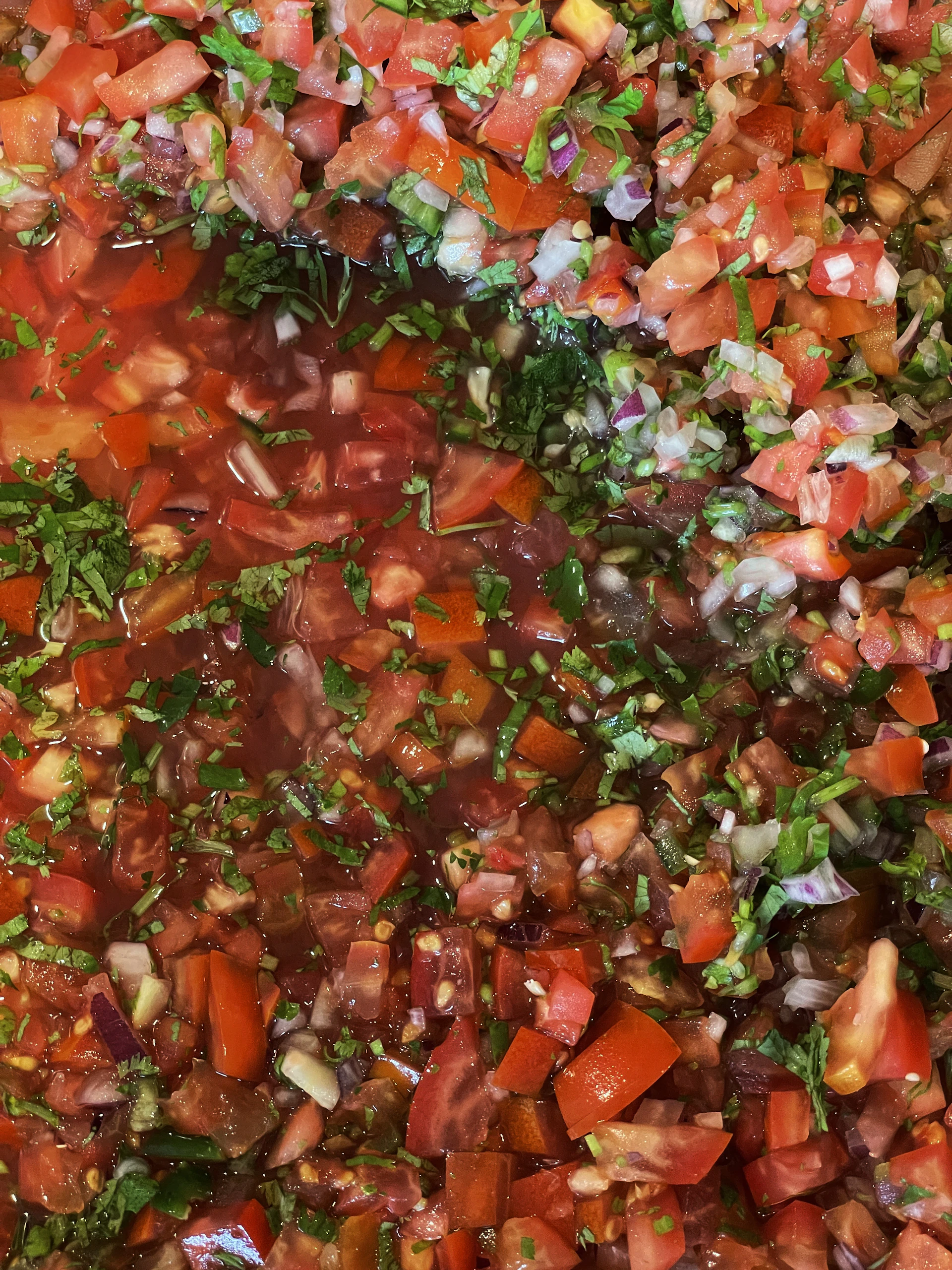 A large pot filled with lots of vegetables