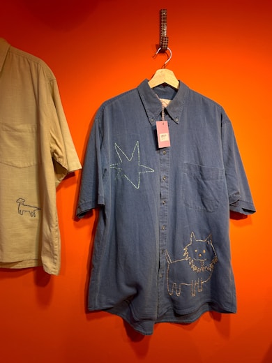 A couple of shirts hanging on a wall