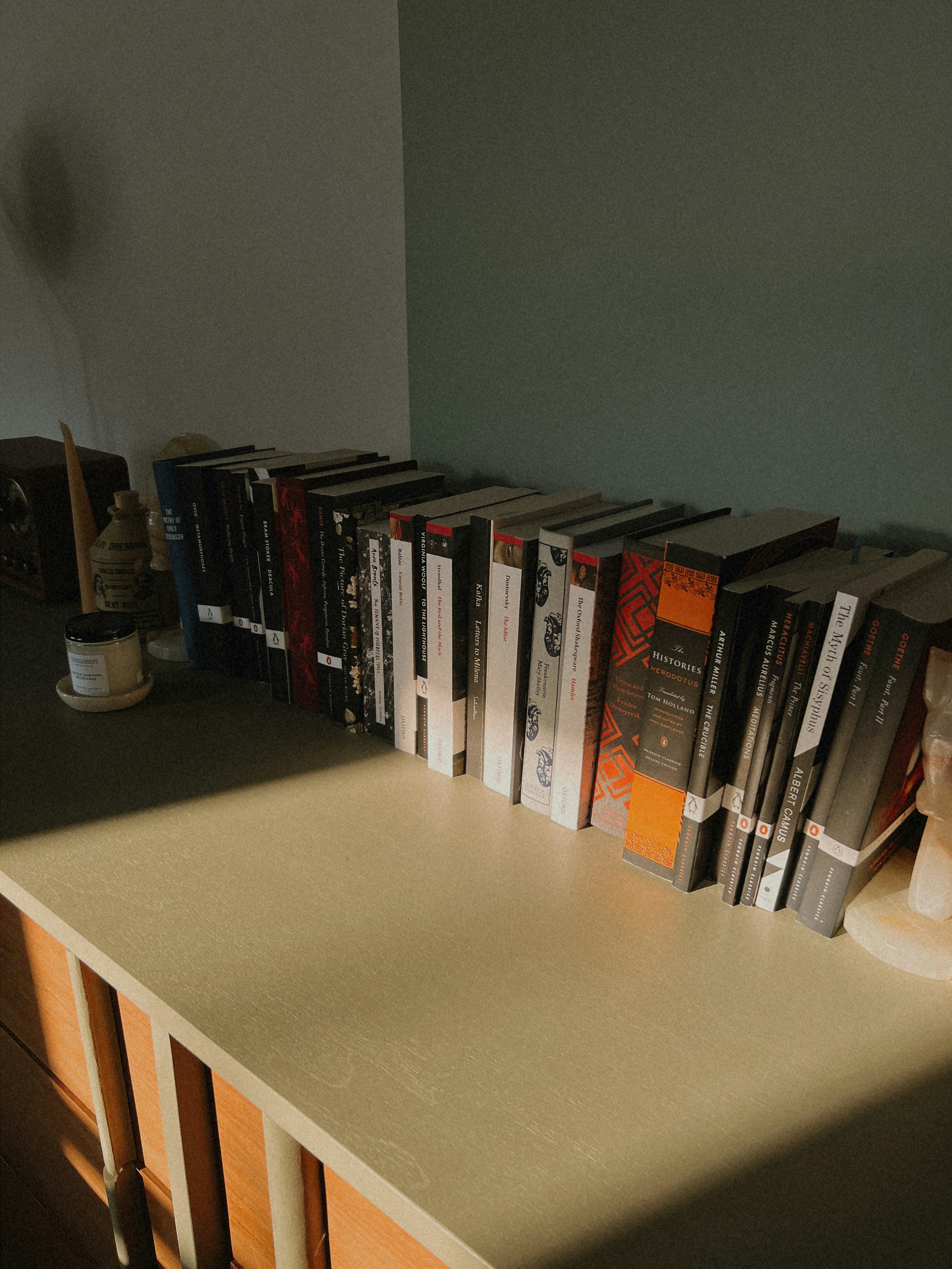 A row of books sitting on top of a table