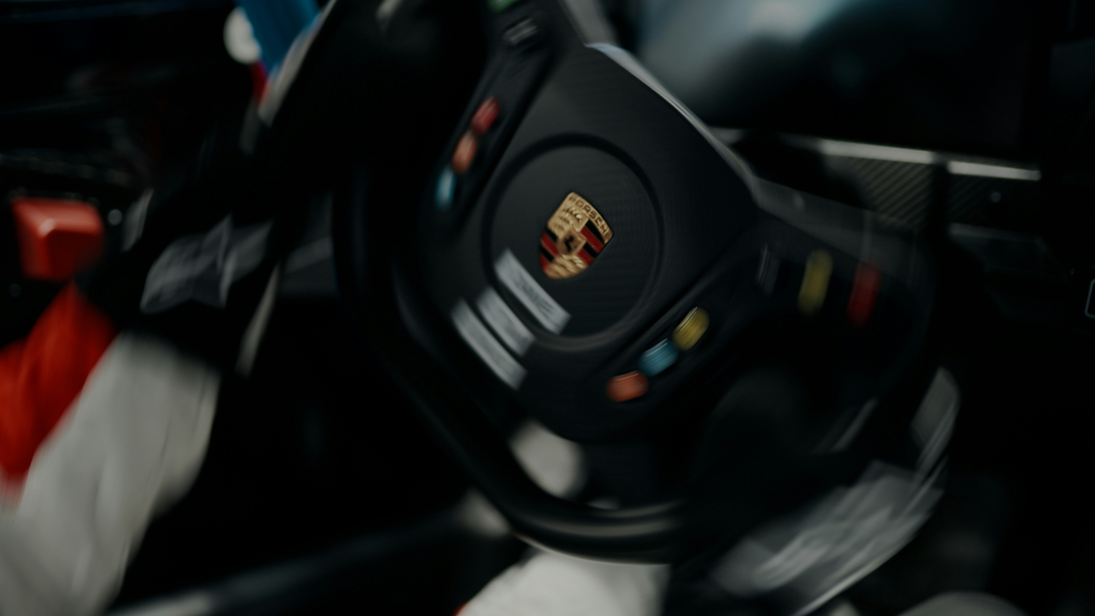 A close up of a steering wheel in a car