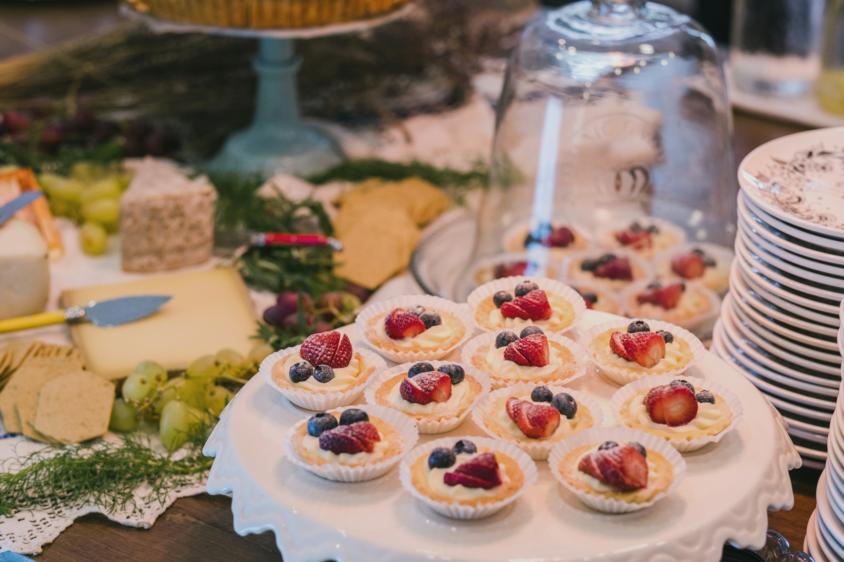 A table topped with lots of desserts and plates