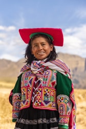 A woman wearing a colorful hat and dress