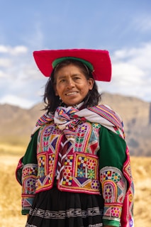 A woman wearing a colorful hat and dress