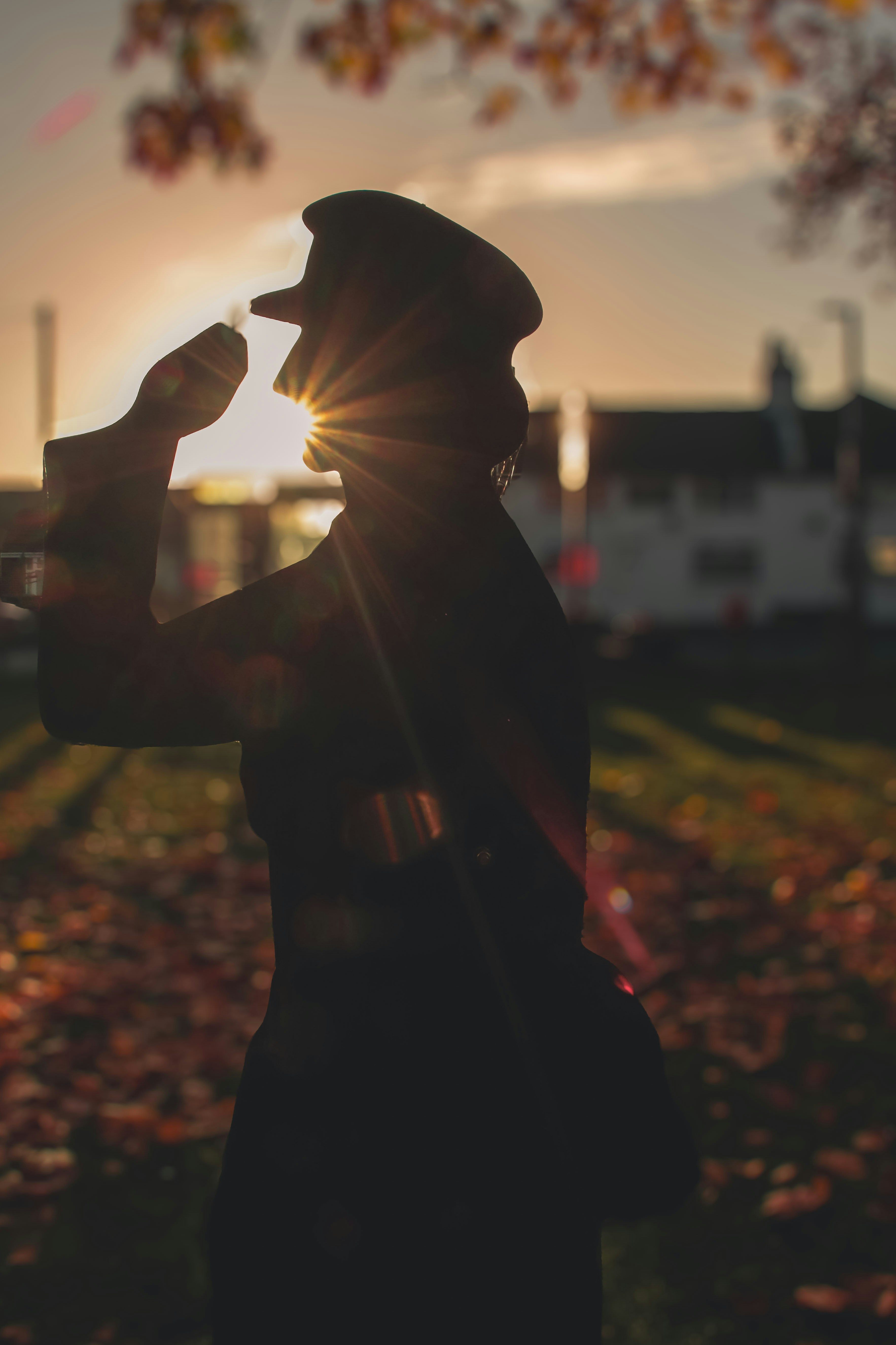 A person standing in a field with a hat on