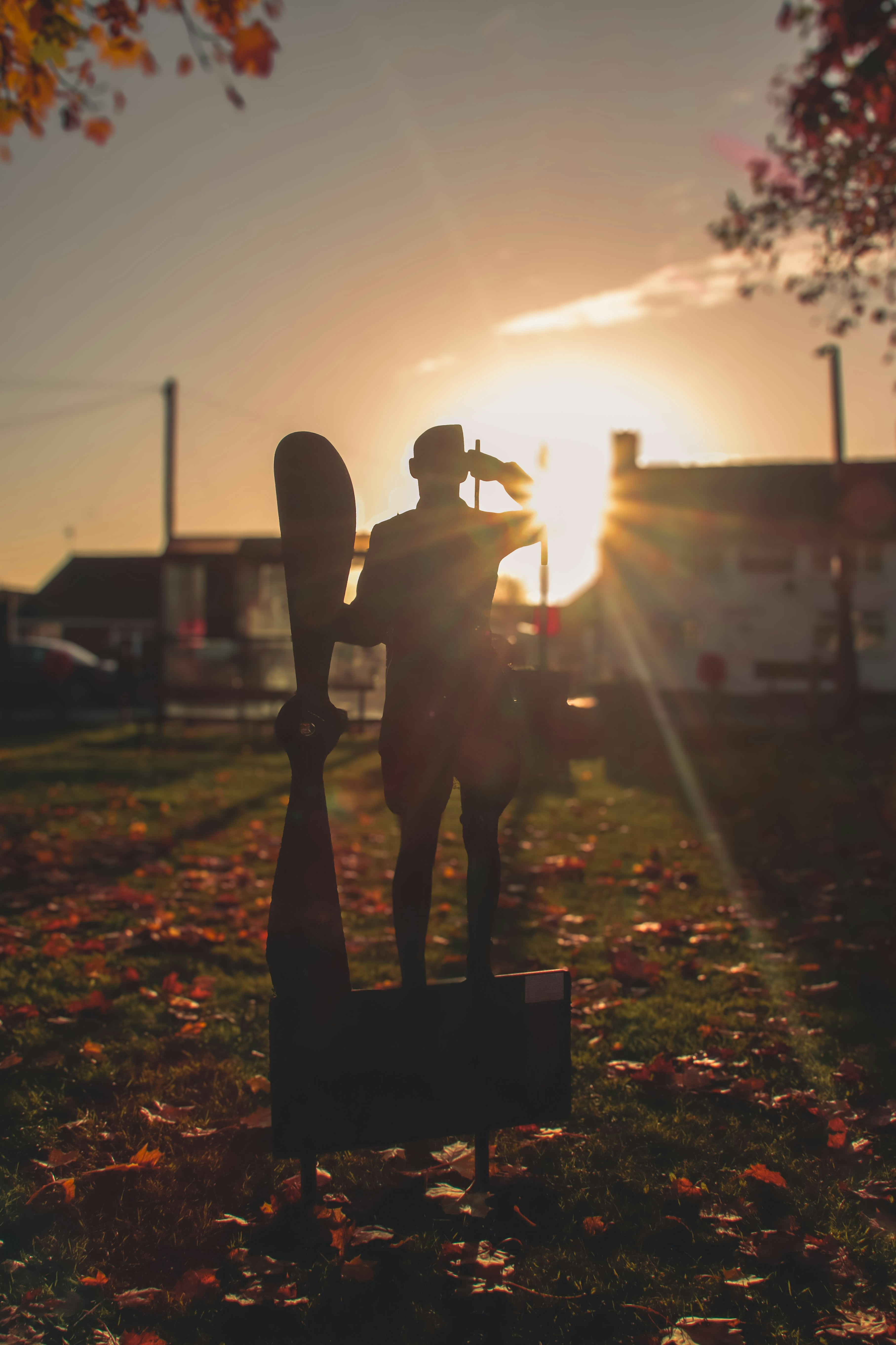 A statue of a man holding a surfboard