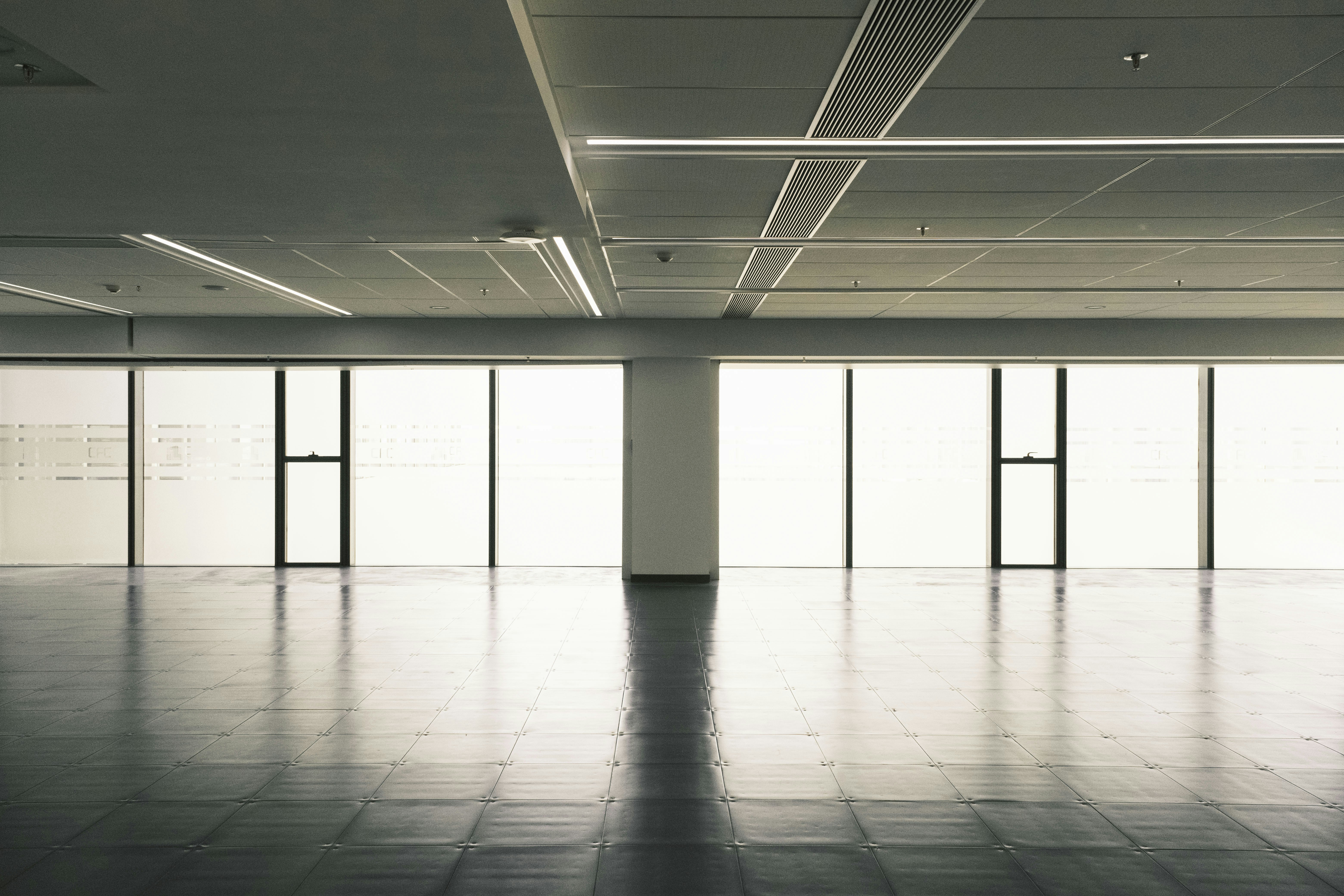 A large empty room with lots of windows