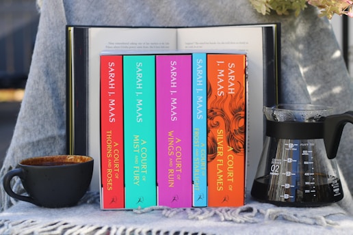 A table topped with books and a cup of coffee