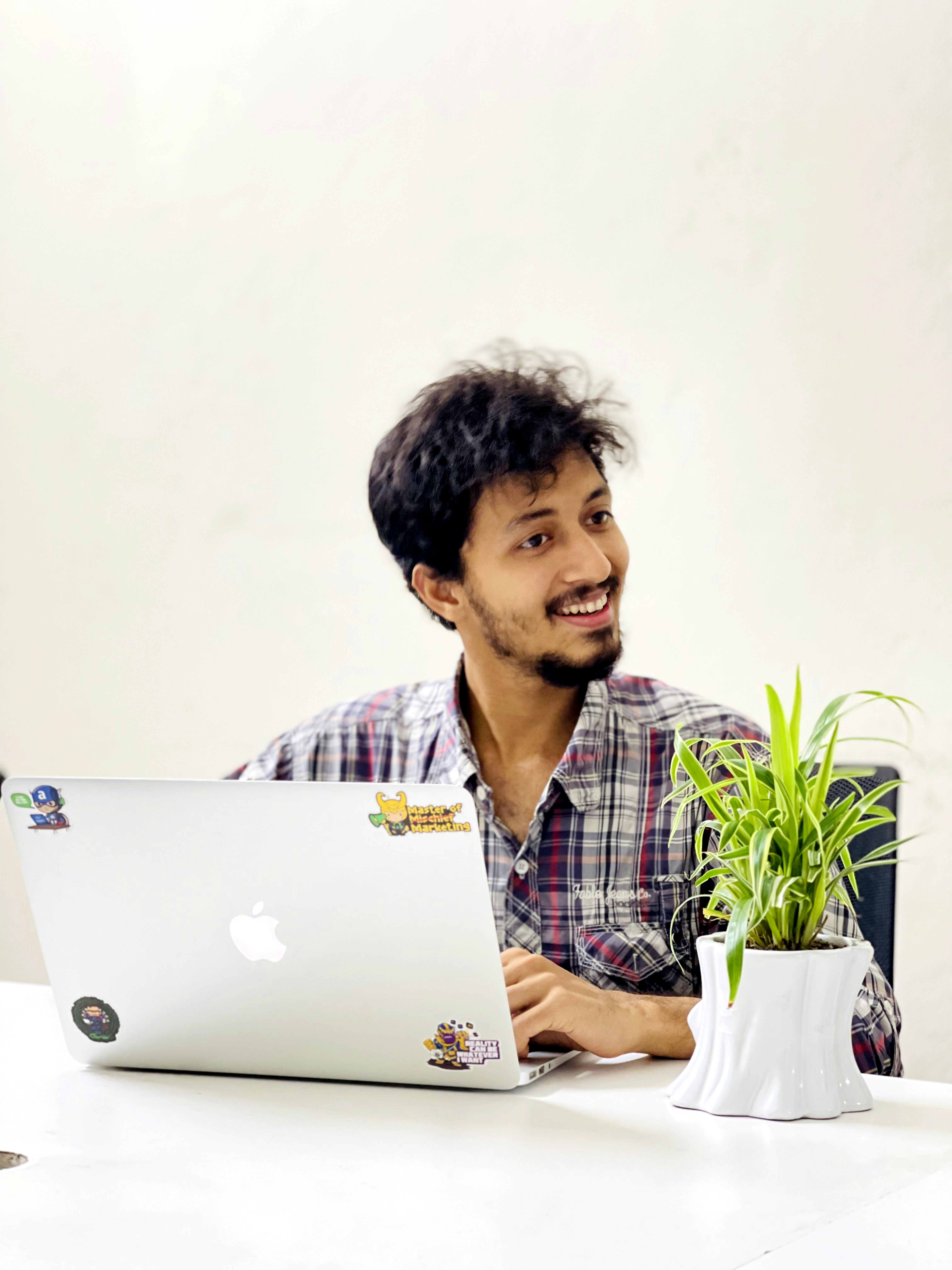 A man sitting in front of a laptop computer