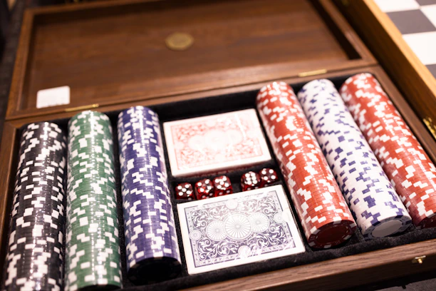 A wooden box filled with lots of playing cards