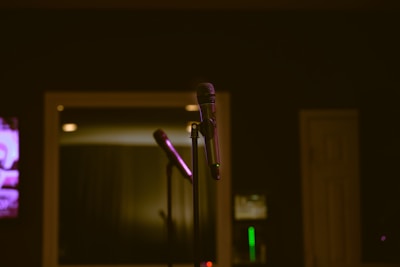 A microphone and a television in a dark room