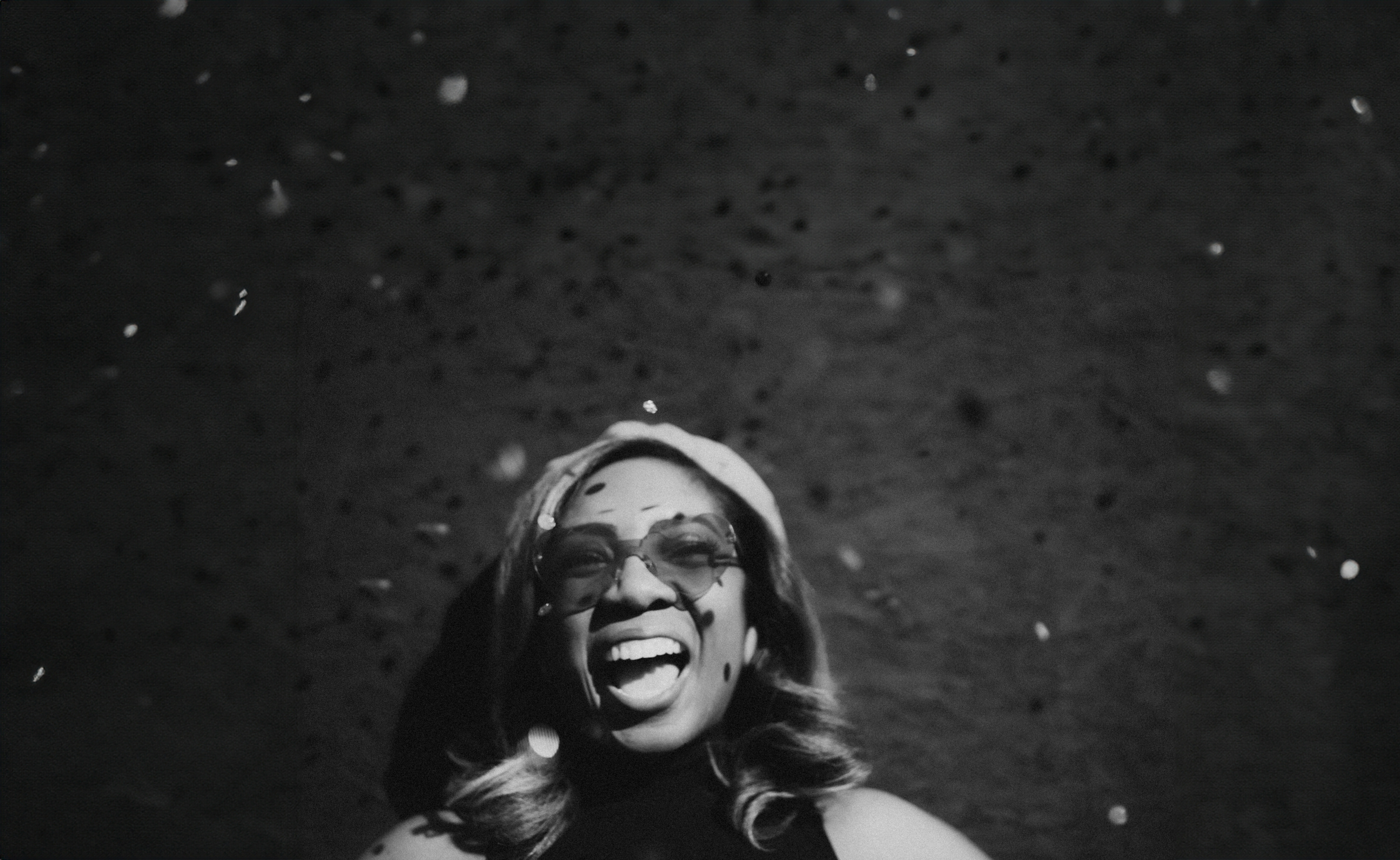 A black and white photo of a woman singing