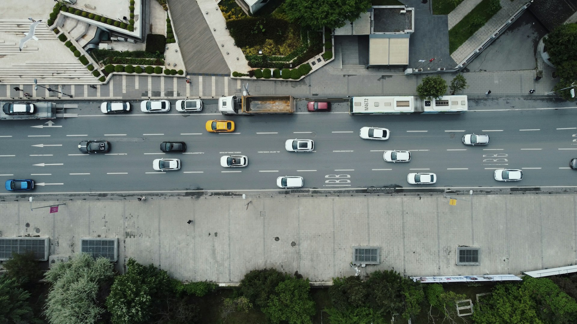 An aerial view of a city street with lots of traffic